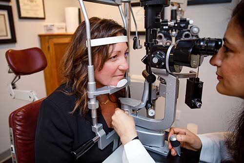 Patient Having Eyes Examined by Doctor