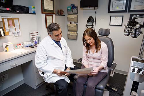 Doctor Looking at Results Together With Patient